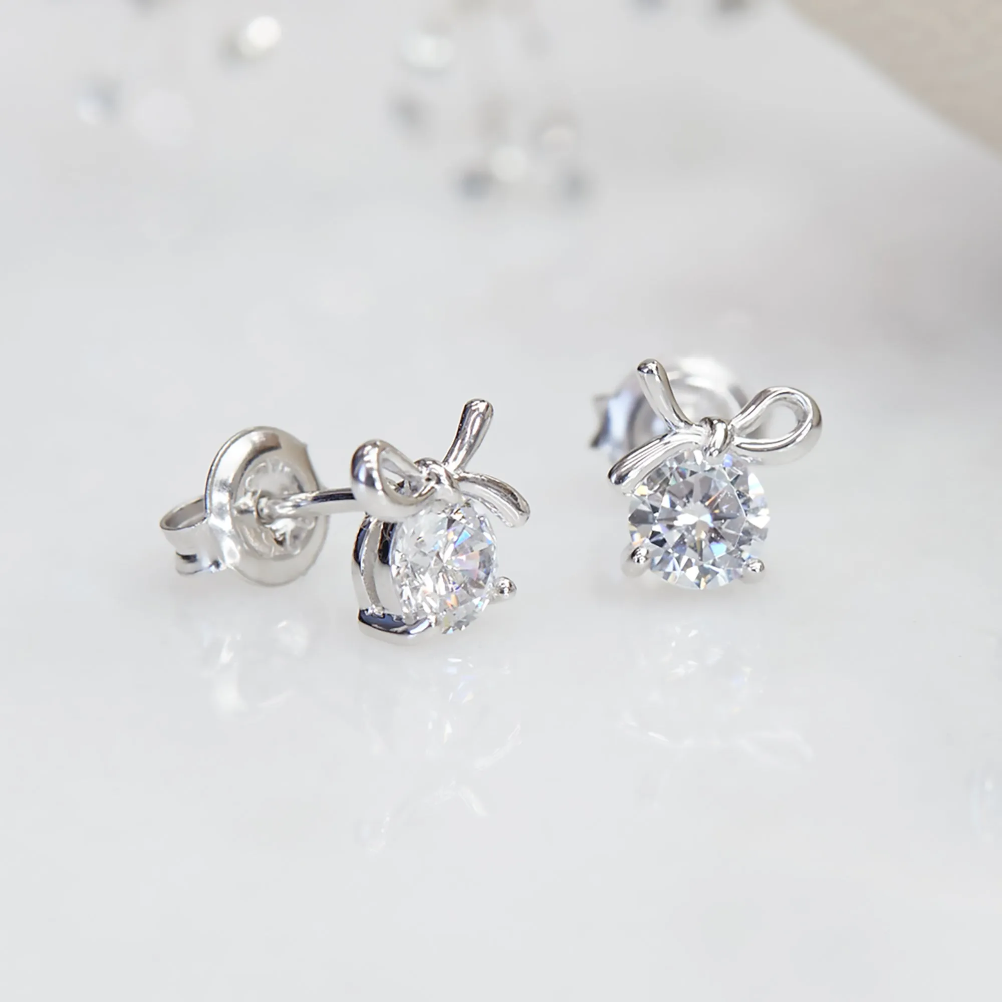 1 CTW Bow Earrings, Platinum Plated Sterling Silver