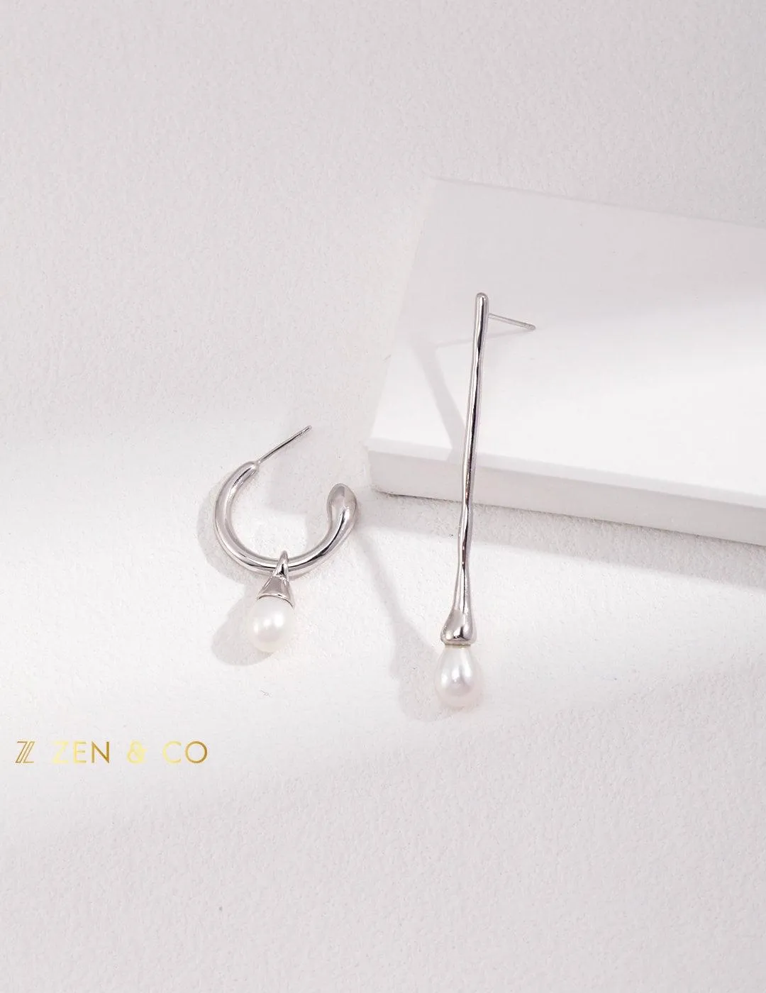 CELINE Asymmetric dangle earrings