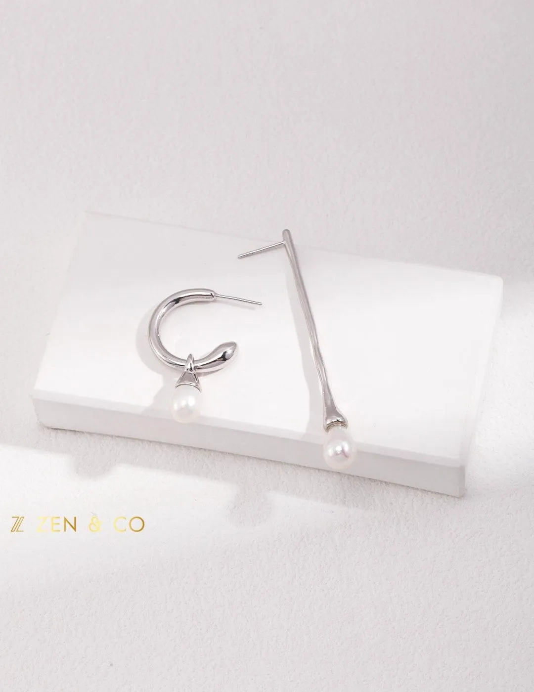 CELINE Asymmetric dangle earrings