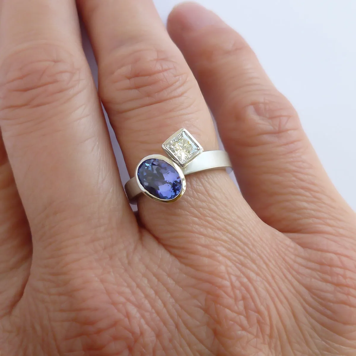 Contemporary platinum and tanzanite two band stacking ring set