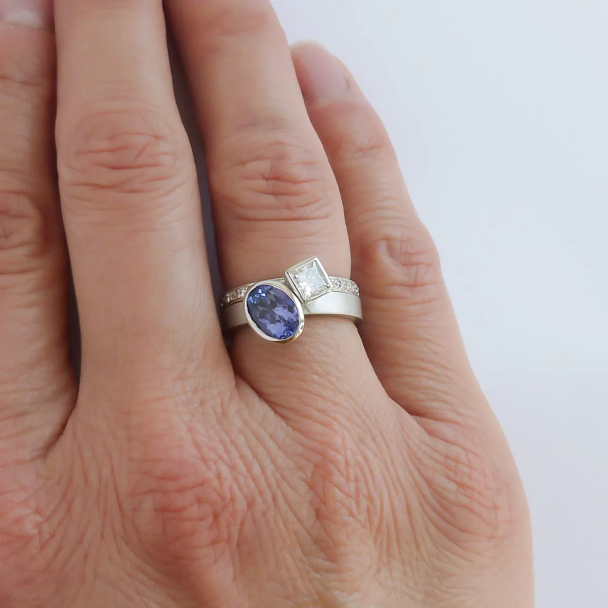 Contemporary platinum and tanzanite two band stacking ring set