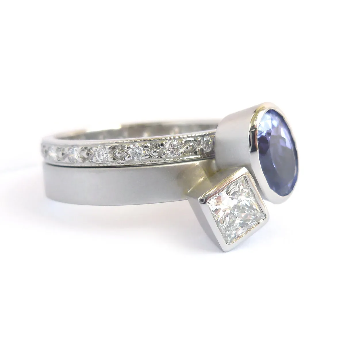 Contemporary platinum and tanzanite two band stacking ring set