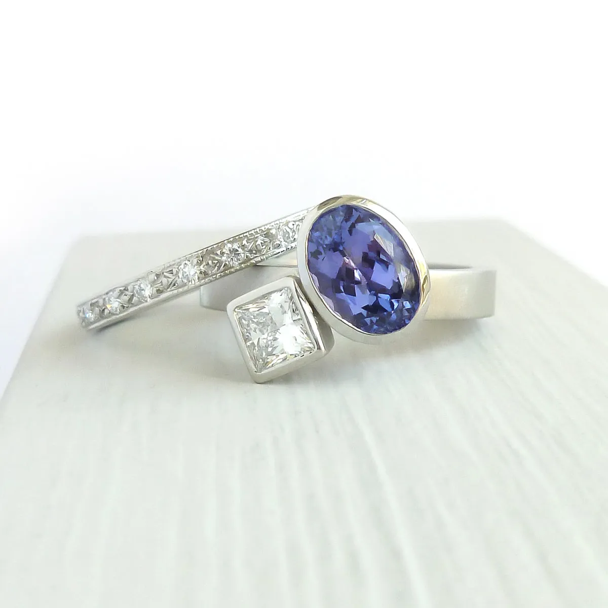 Contemporary platinum and tanzanite two band stacking ring set
