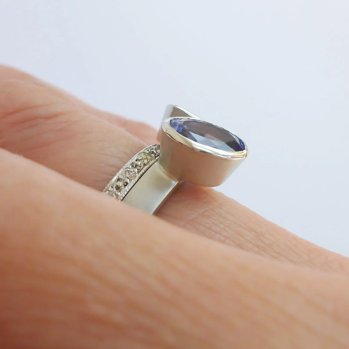 Contemporary platinum and tanzanite two band stacking ring set