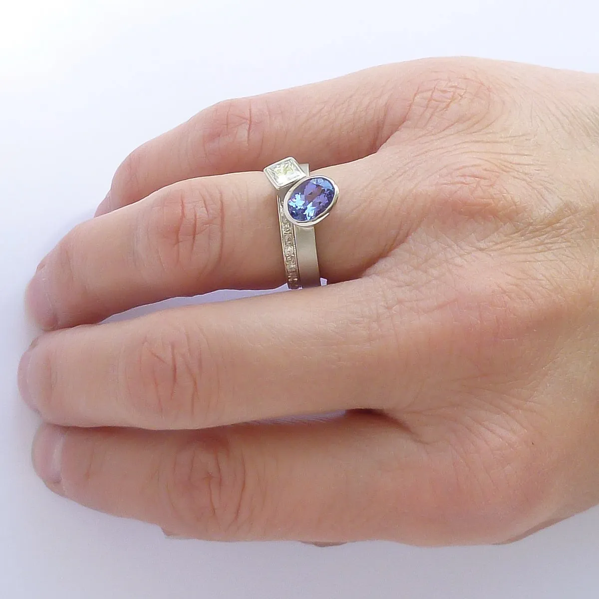 Contemporary platinum and tanzanite two band stacking ring set