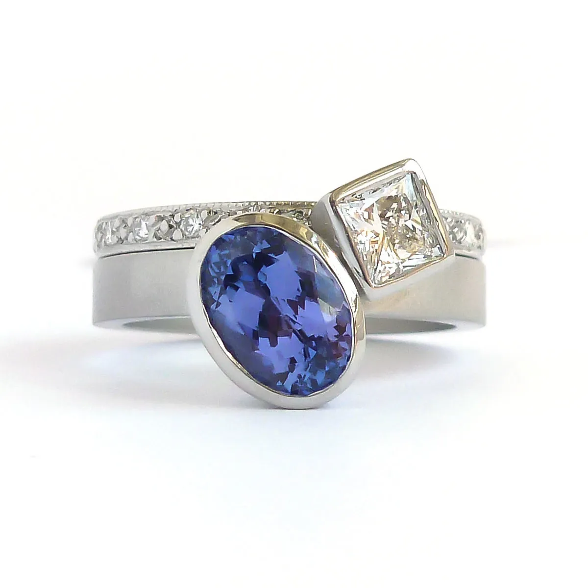 Contemporary platinum and tanzanite two band stacking ring set