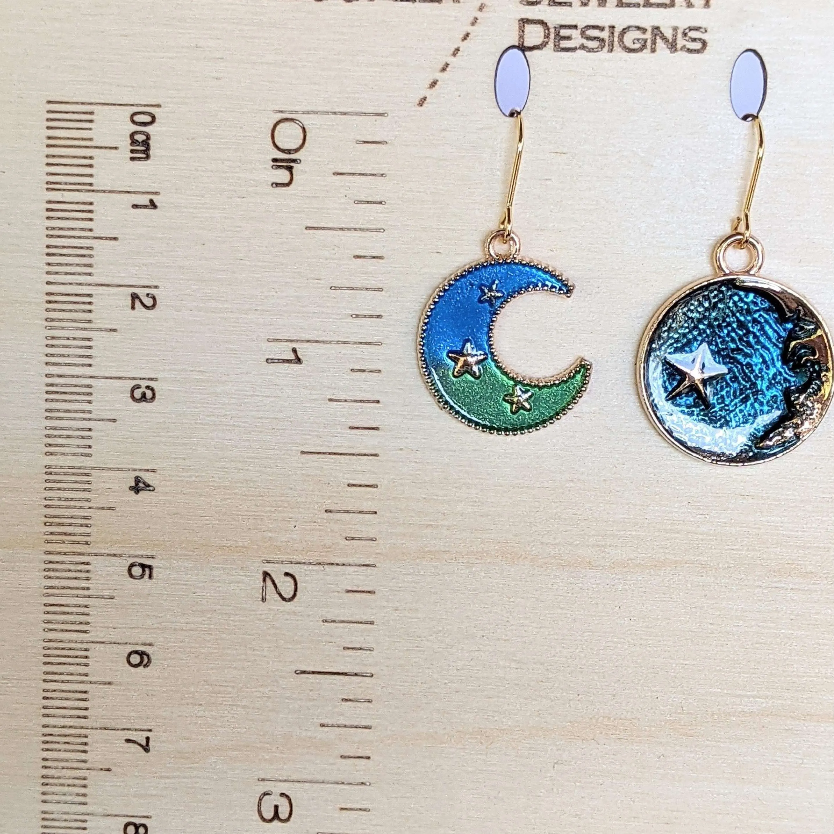 Mismatched Blue Crescent Moon and Earth dangle earrings