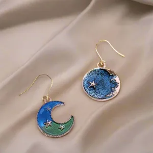 Mismatched Blue Crescent Moon and Earth dangle earrings