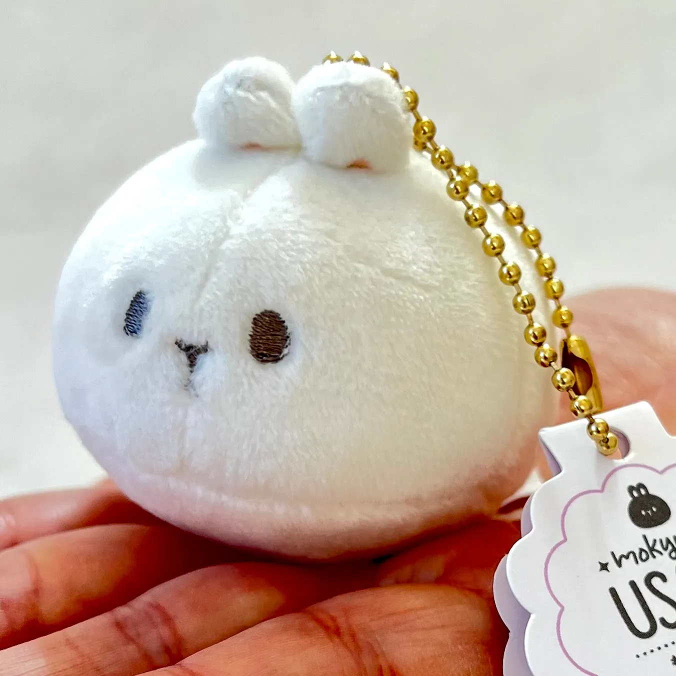 X 63418 ROUND RABBIT PLUSH CHARMS-DISCONTINUED