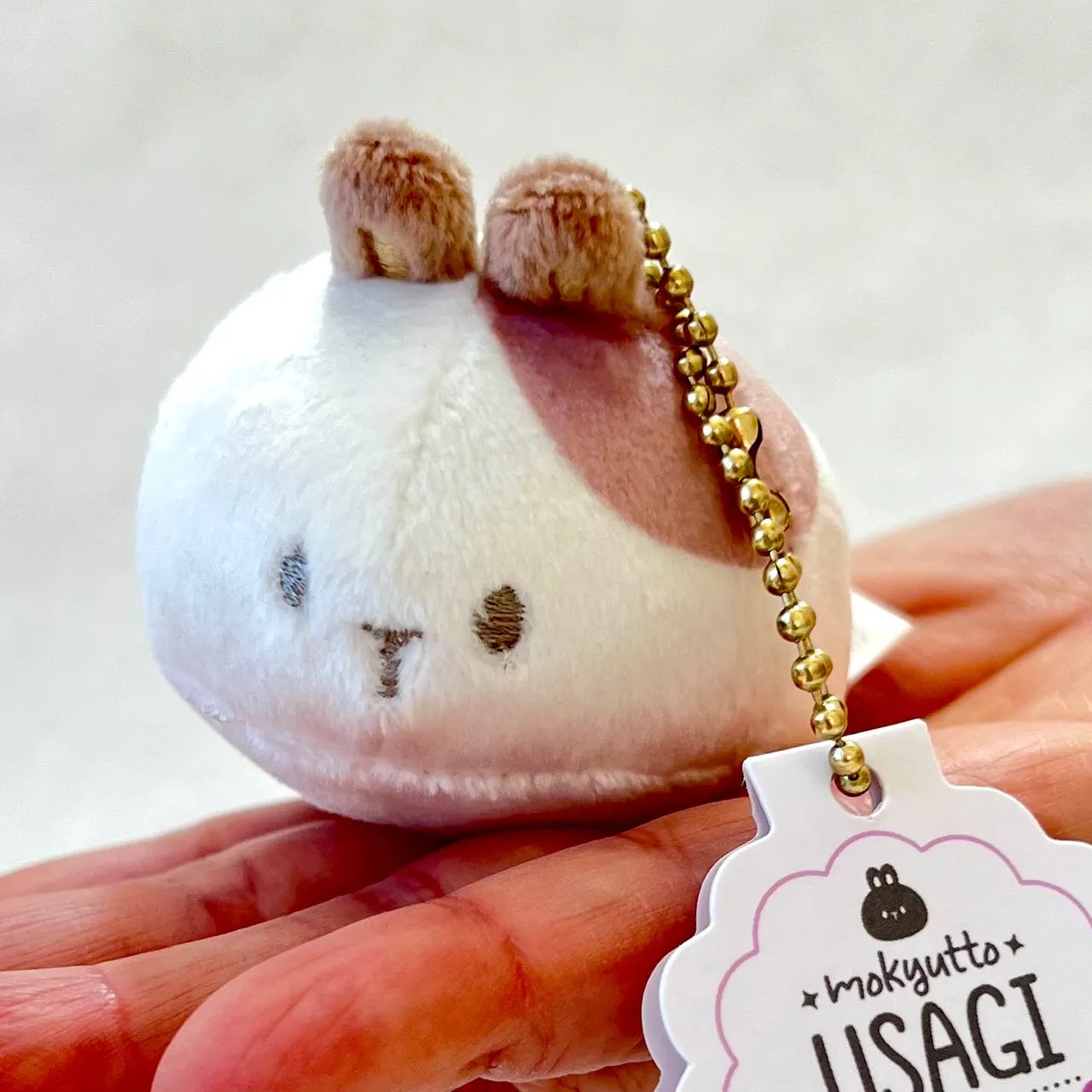 X 63418 ROUND RABBIT PLUSH CHARMS-DISCONTINUED